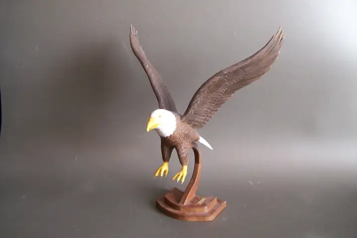Eagle, wood sculpture by Mel Derzaph
