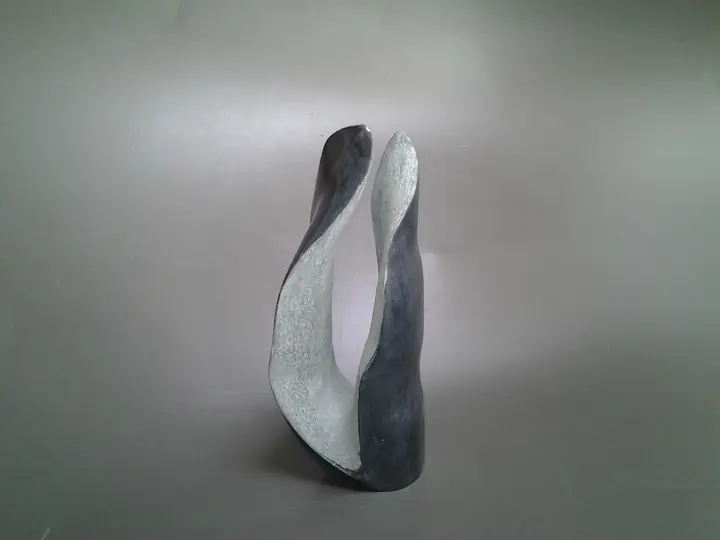 Gossip, stone sculpture by Mel Derzaph